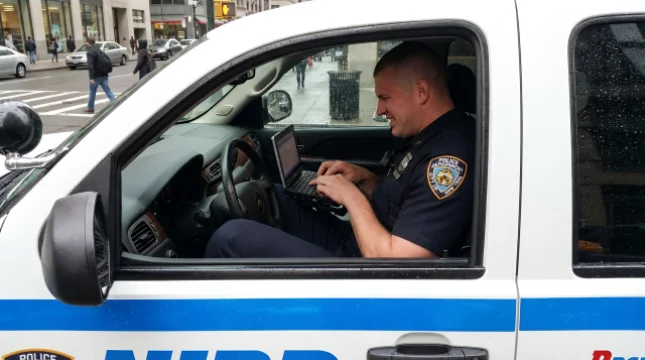 Tall Officer Reviews Department Laptop Purchase Decisions With Frustration